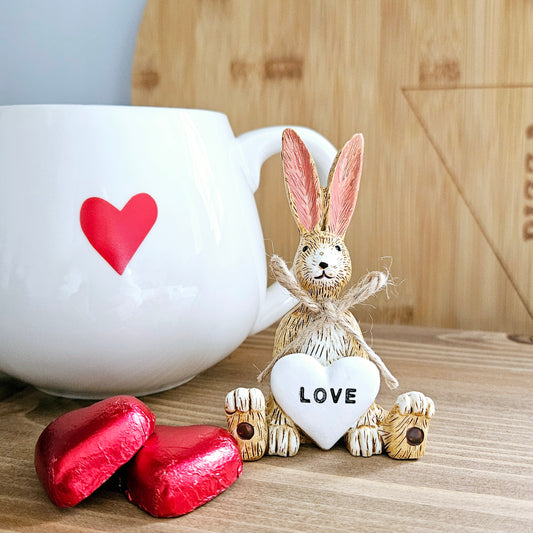 cute sitting rabbit ornament with a white heart saying love
