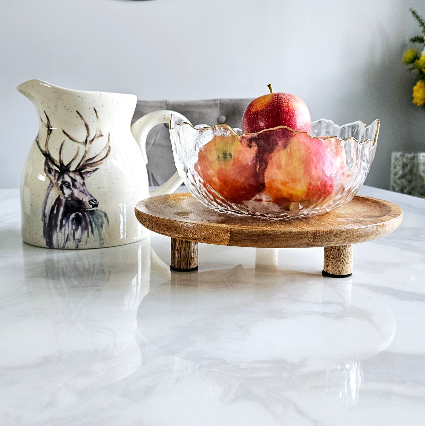 round wooden styling tray with feet