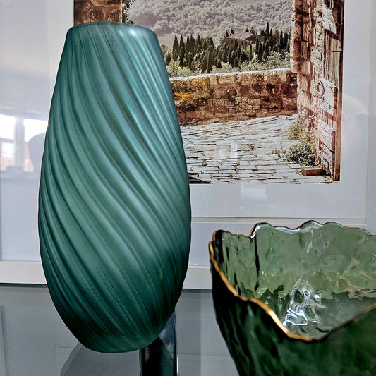 green coloured glass vase made by hestia