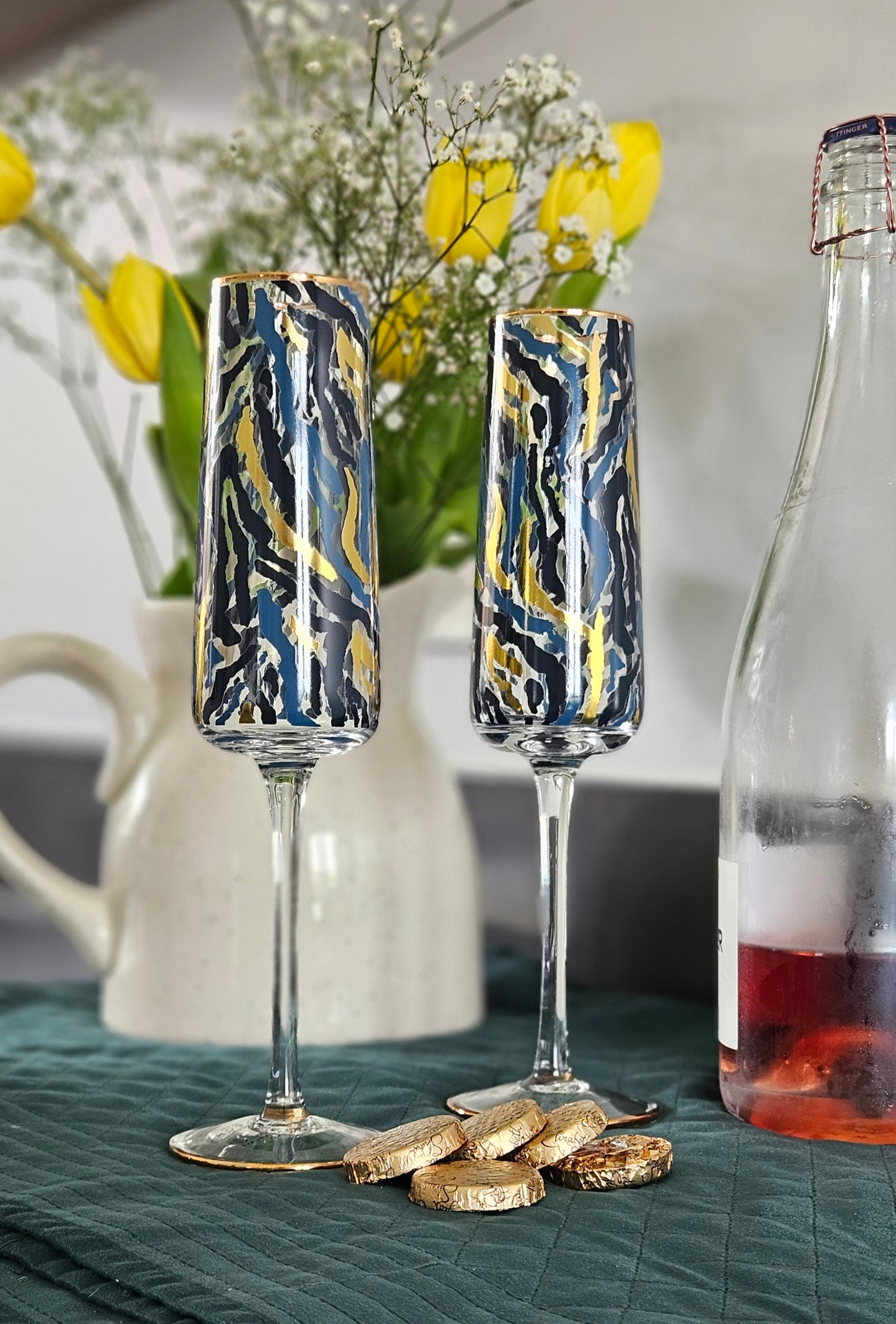 Frida set 0f 2 zebra print champagne flute glasses with blue and gold design in a gift box