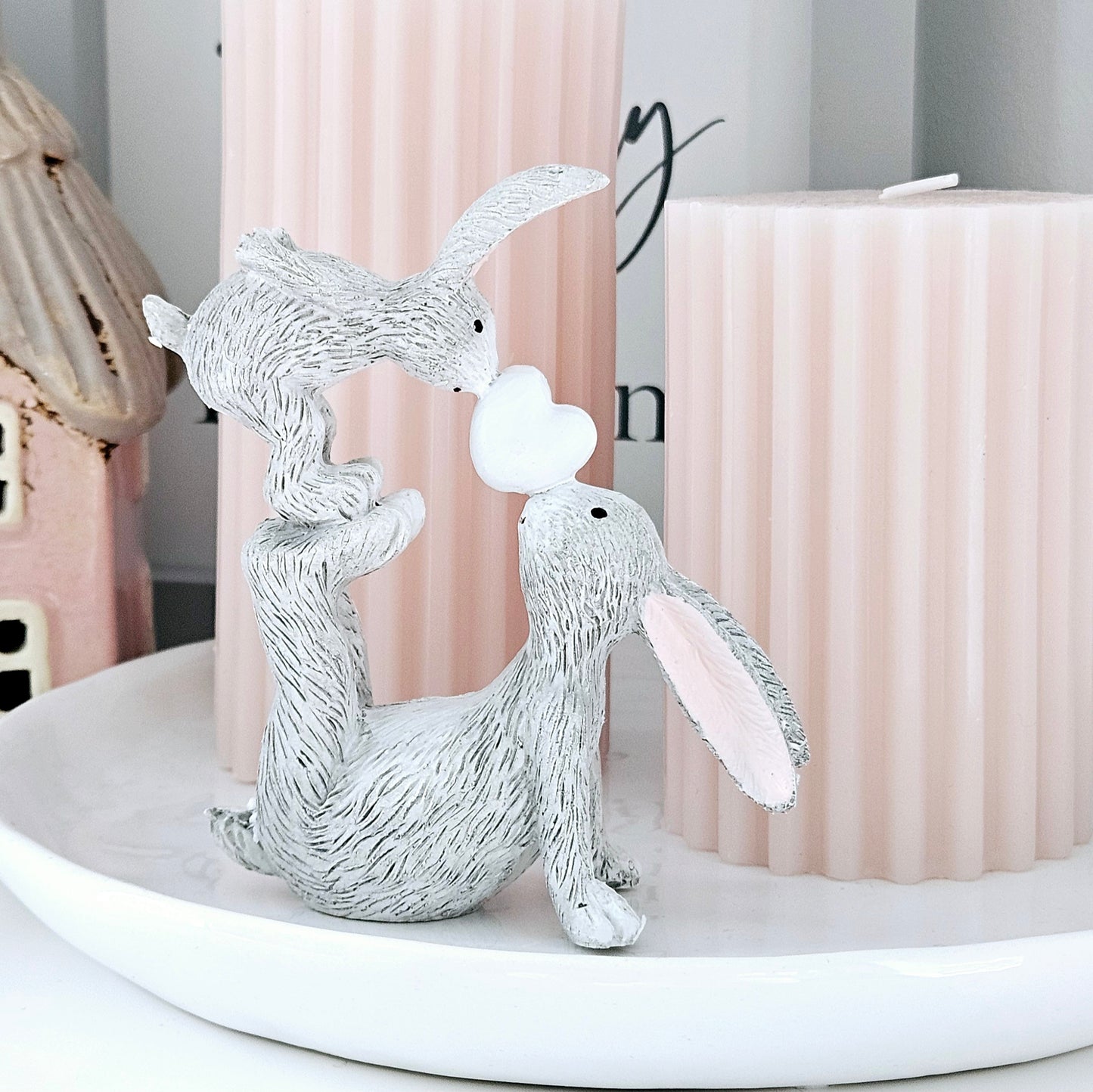 grey kissing mum and baby bunnies figurine with a white heart between them