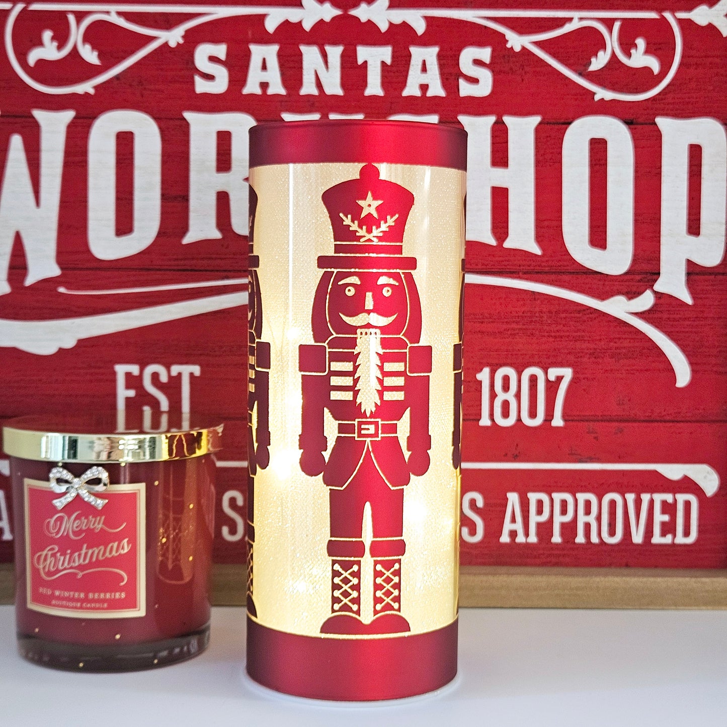 Nutcracker in led tube light red and gold