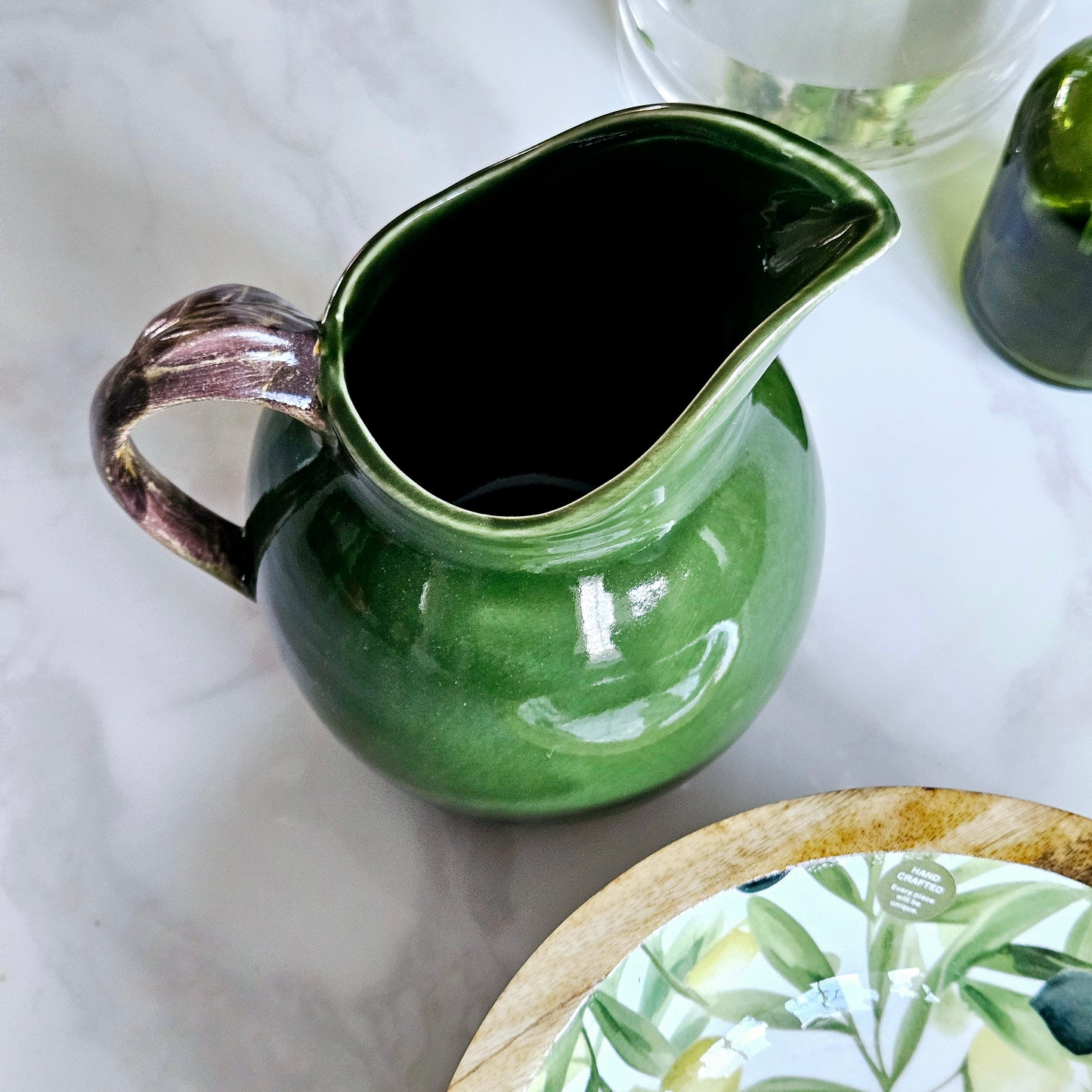 olive green jug with brown leaf designed handle