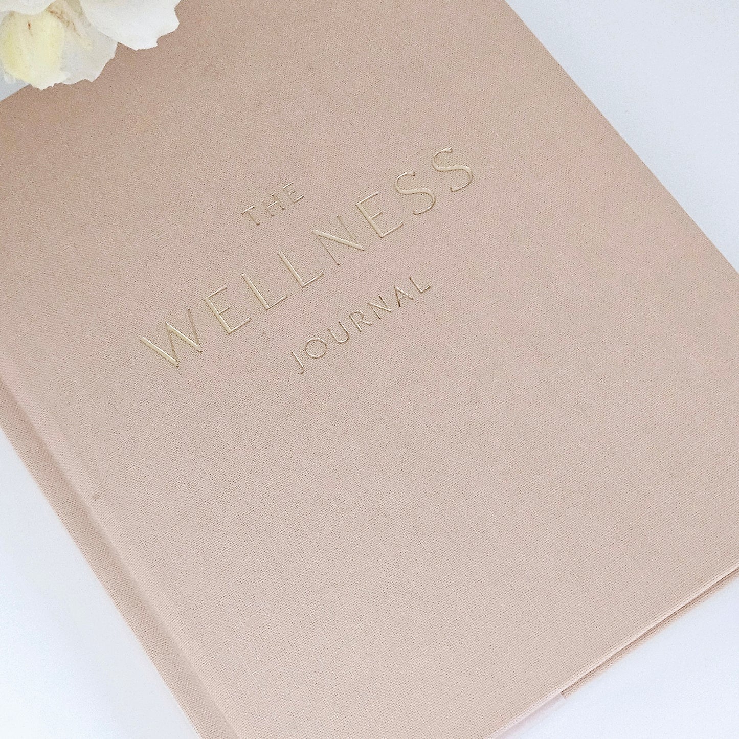 the wellness journal by Sophia in pink and gold