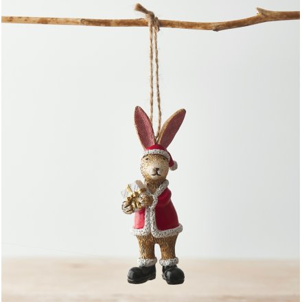 Hanging santa bunny holding a present on a jute string