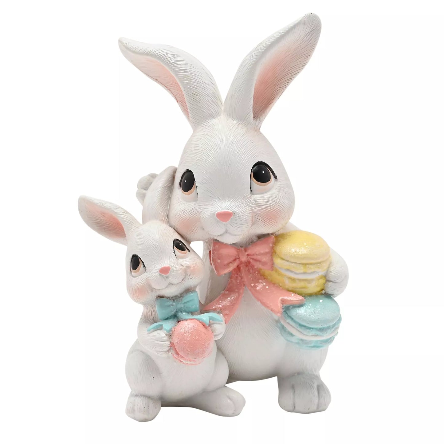 Two ceramic rabbits, one larger and one smaller, holding Easter pastel macarons and pink bows