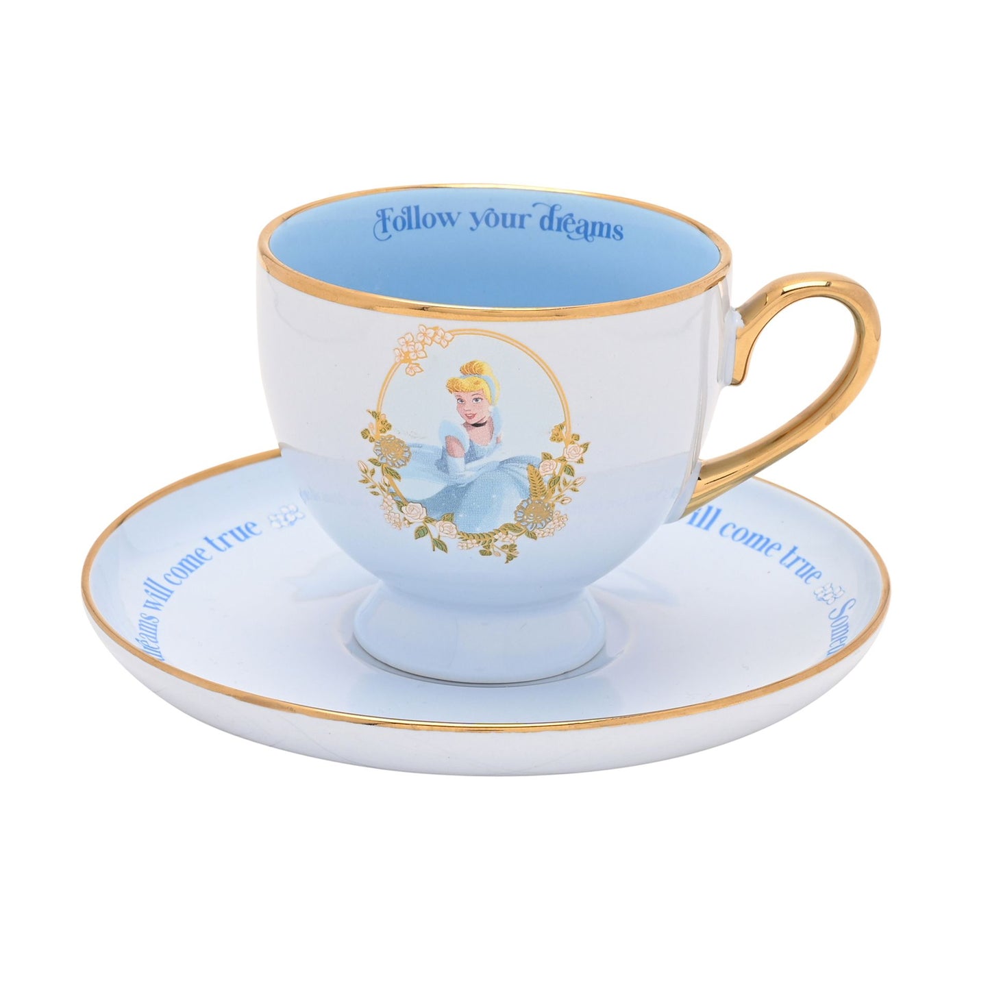 cinderella tea cup and saucer set in blue with follow your dreams text and gold rim and handle