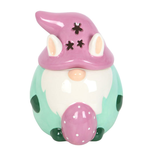 easter bunny gonk oil burner in pastel colours holding an egg