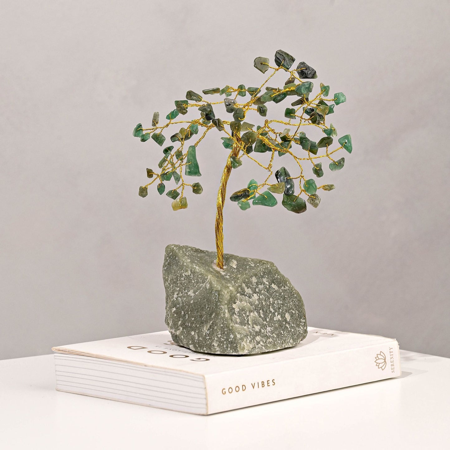 small green gemstone tree with crystal leaves and gold metal branches