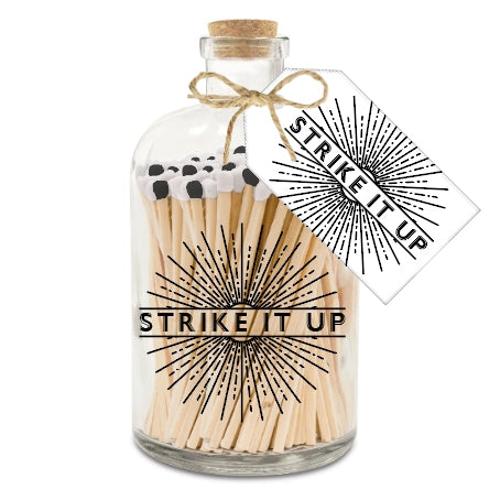 Matches With a Black/White Top In a Glass Jar With "Strike It Up" Text On Front And Tag Around The Neck. With a Cork Stopper