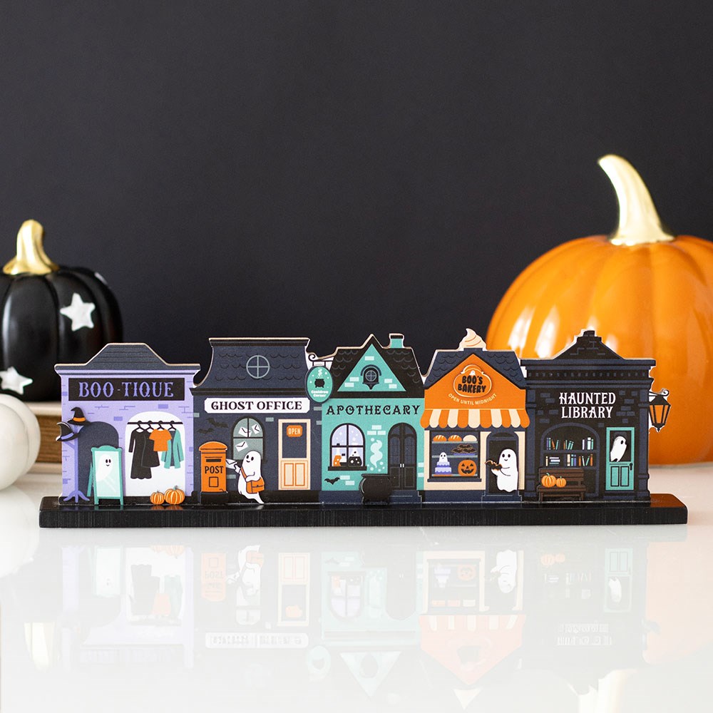 Halloween-themed model town with colourful buildings and pumpkins spooky street mdf