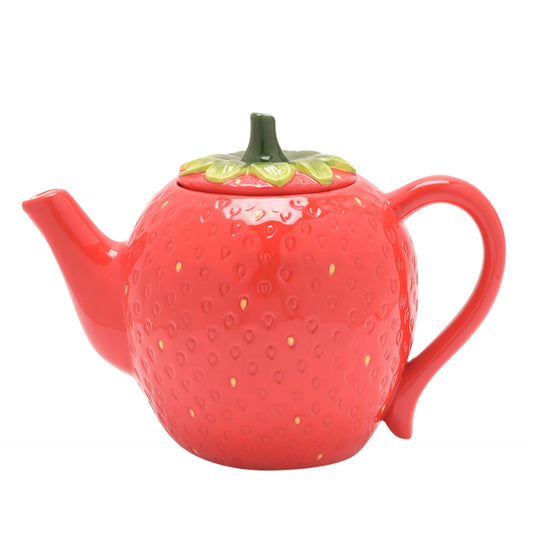 strawberry teapot in red with green stalk lid by the cottage garden 
