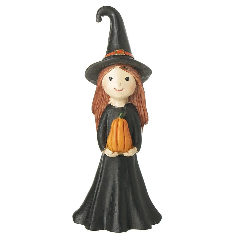Halloween girl witch holding squash decoration