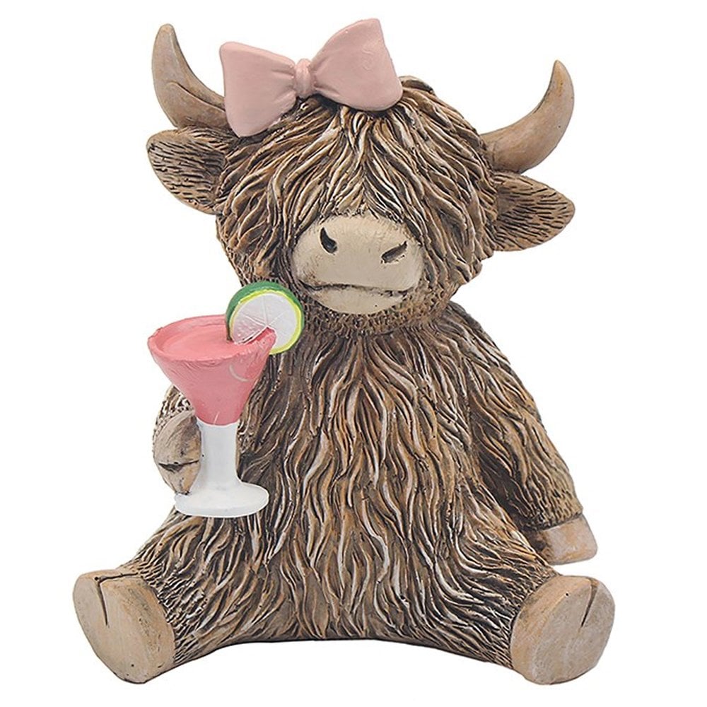 Statue of a Highland cow with a pink bow, holding a cocktail,