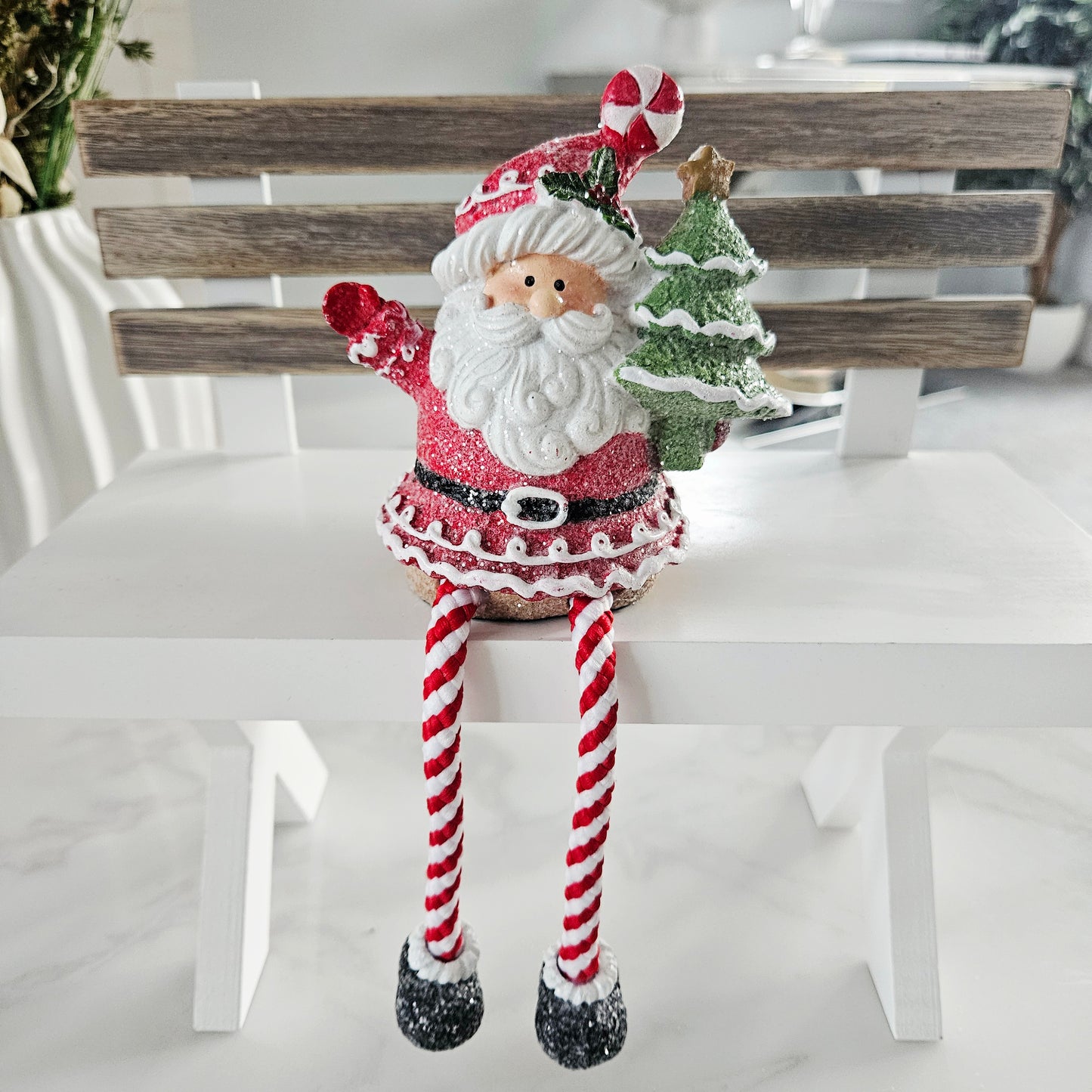 Decorative Santa Claus figure with candy cane legs