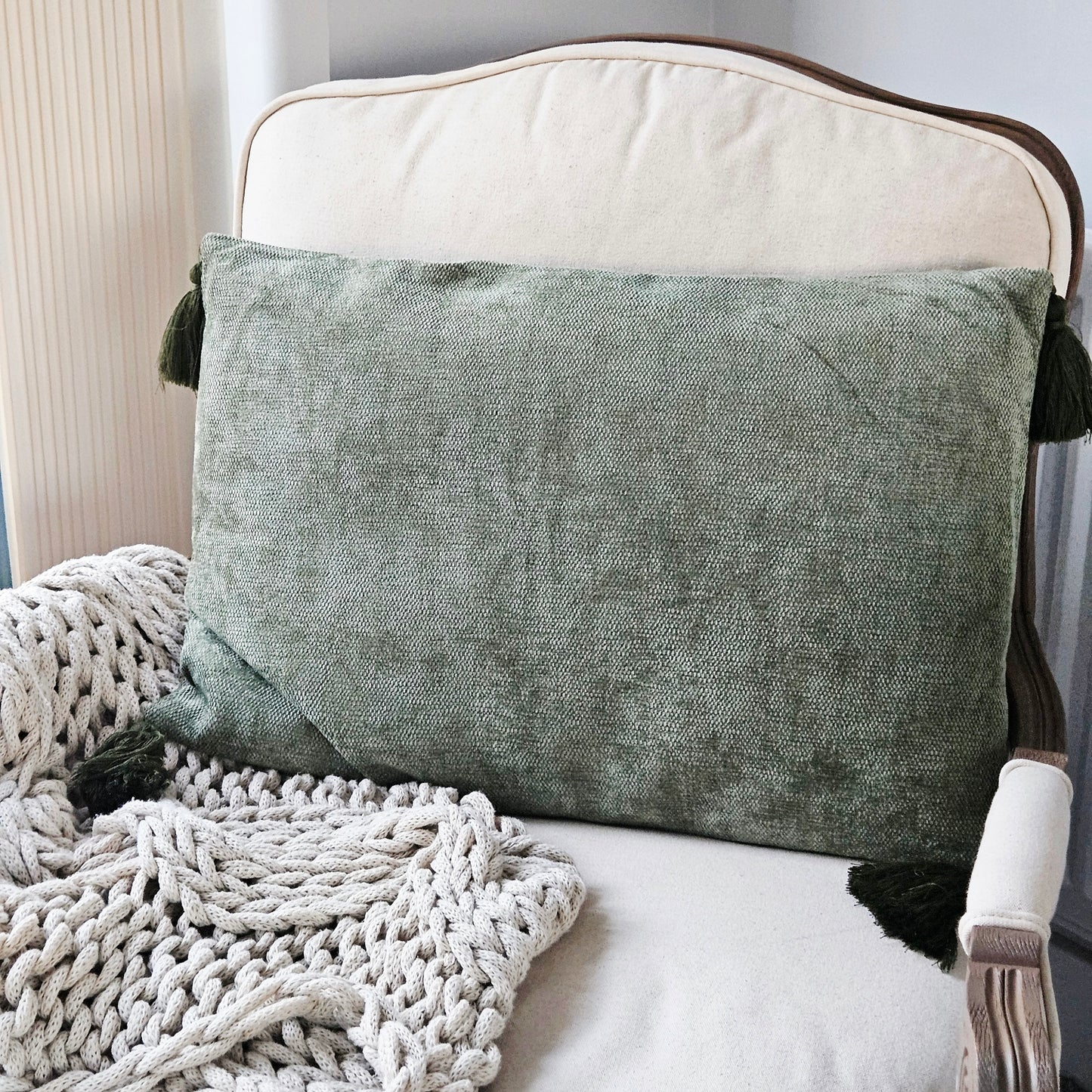 Green tasselled rectangular cushion