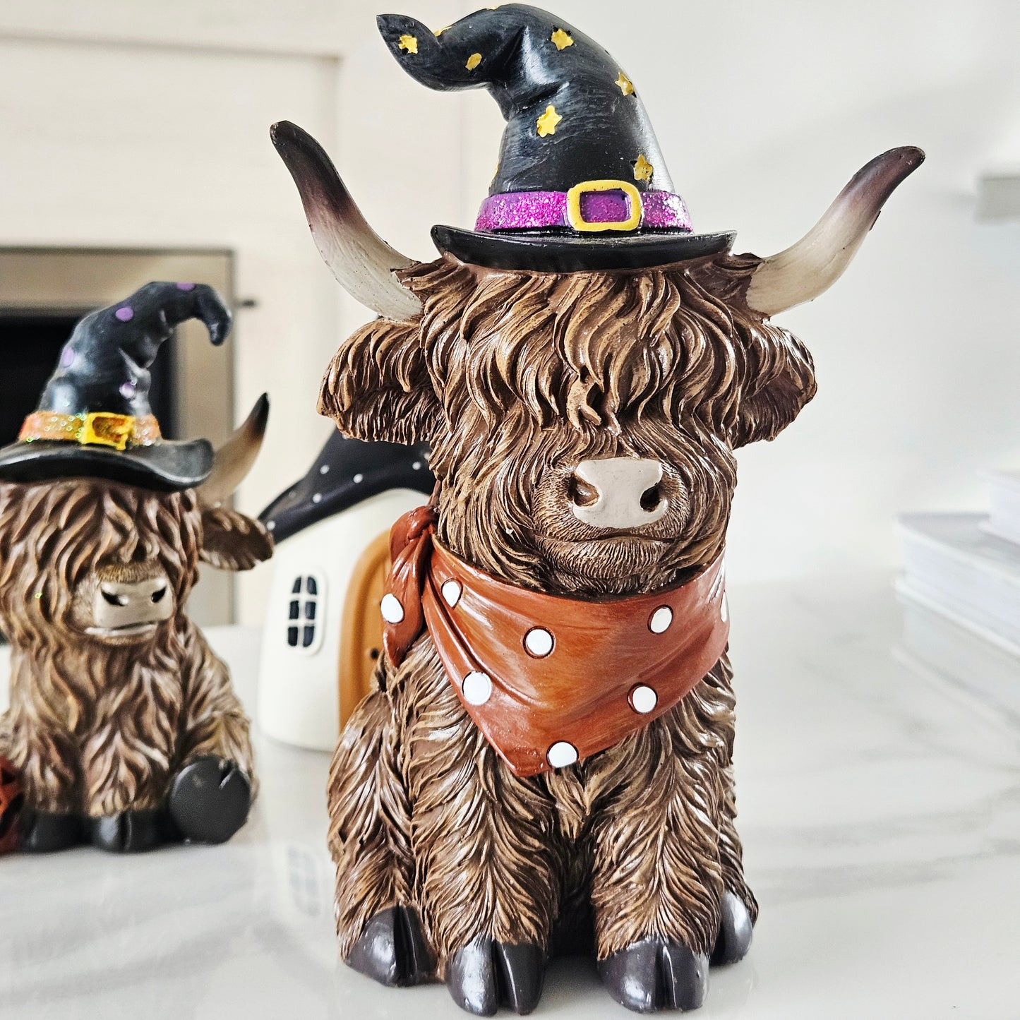 spooky highland cow ornament 18cm wearing a witches hat and scarf
