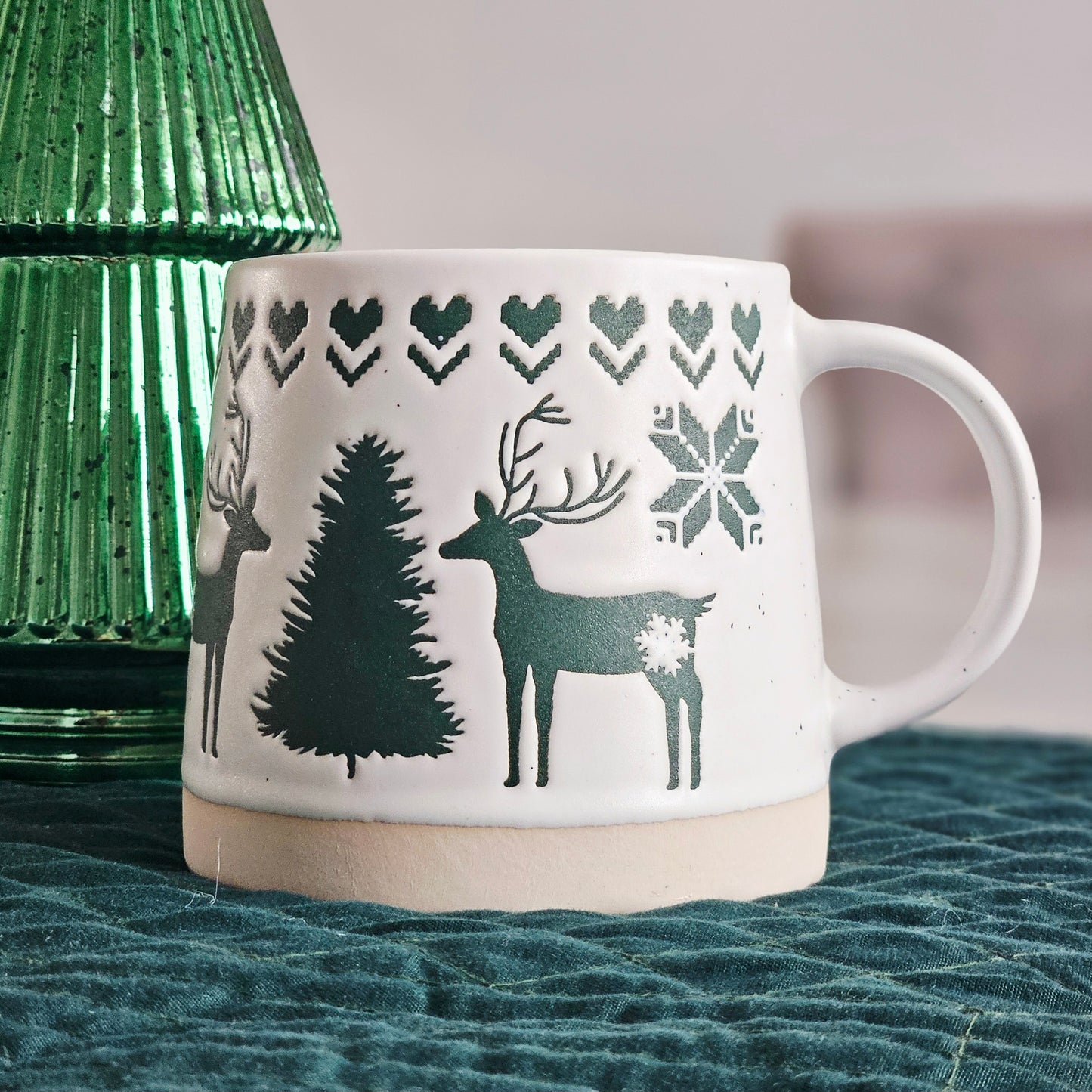 green tapered reindeer mug with motif details