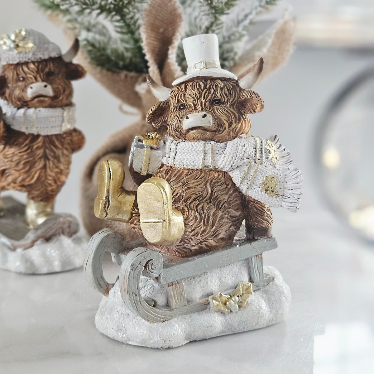 Christmas Highland Cow on Sleigh Decoration β 15cm