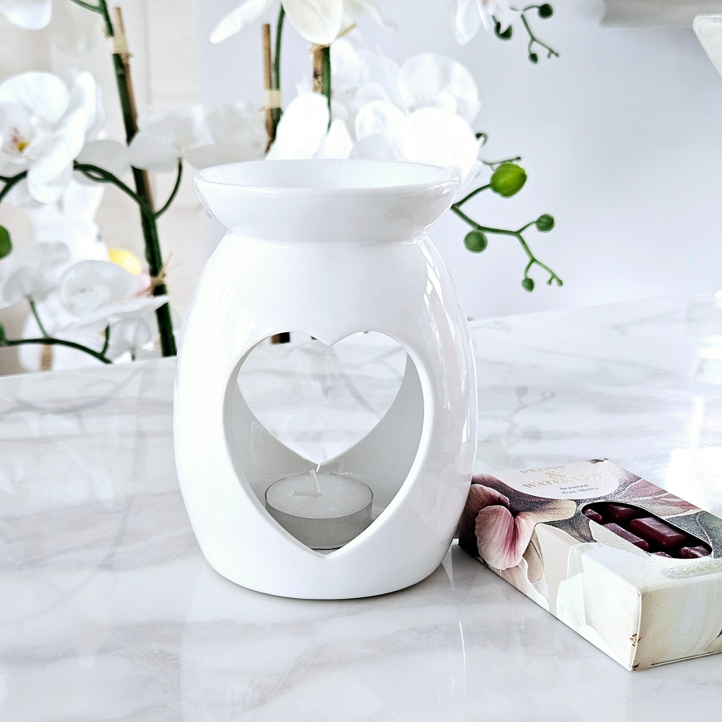 ceramic white large heart cut out wax warmer by candlelight