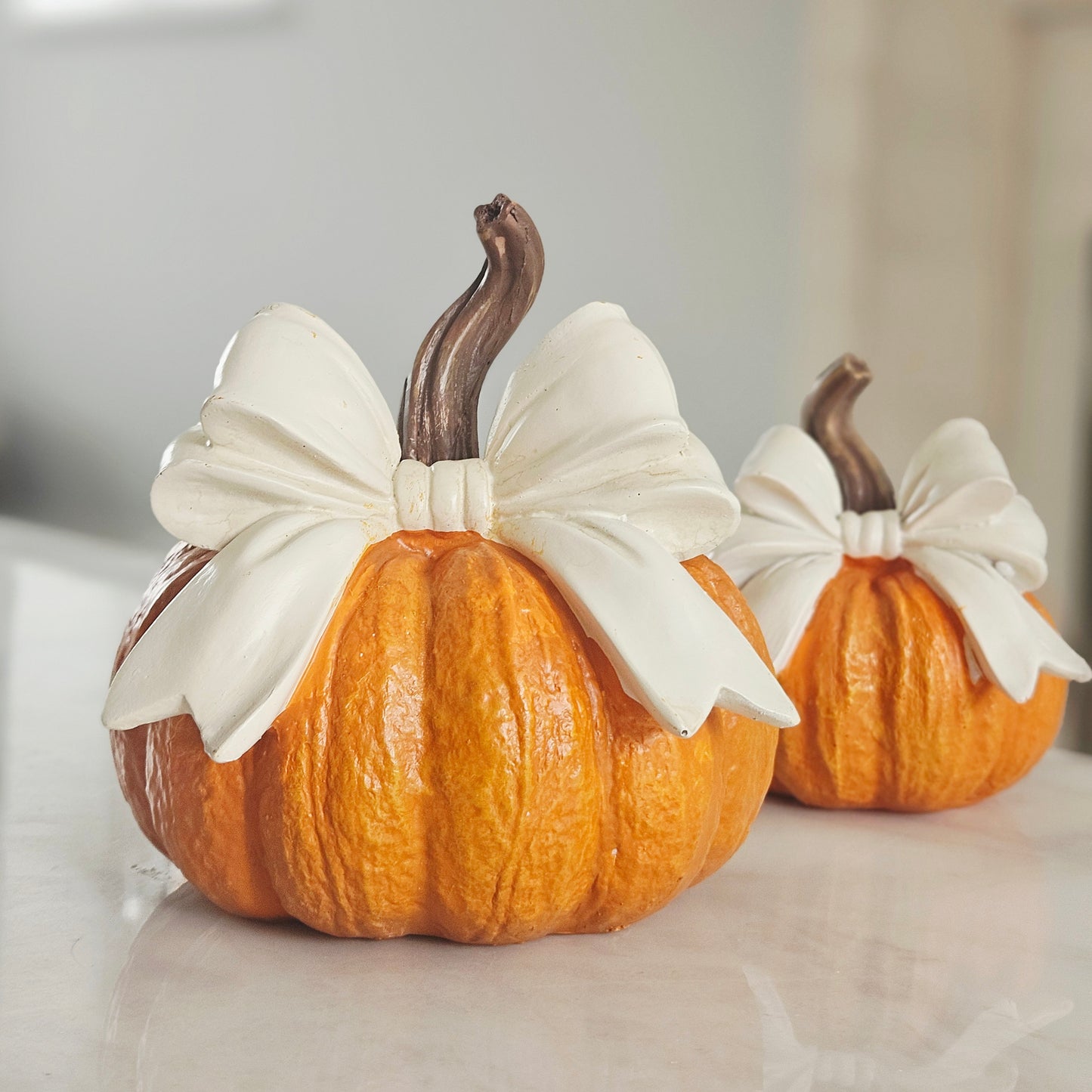Decorative prange pumpkin with white bow 14cm
