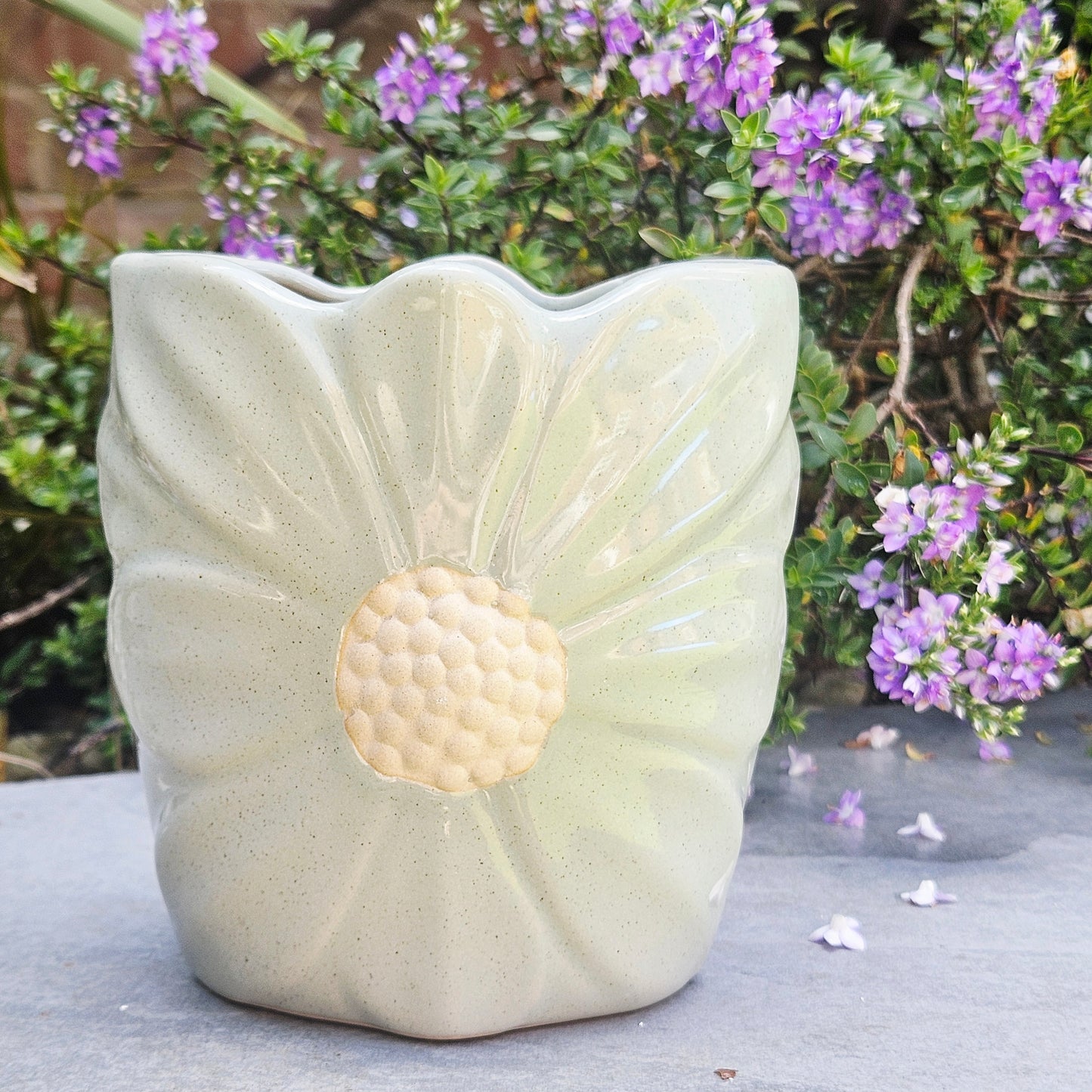 green ceramic daisy plant pot