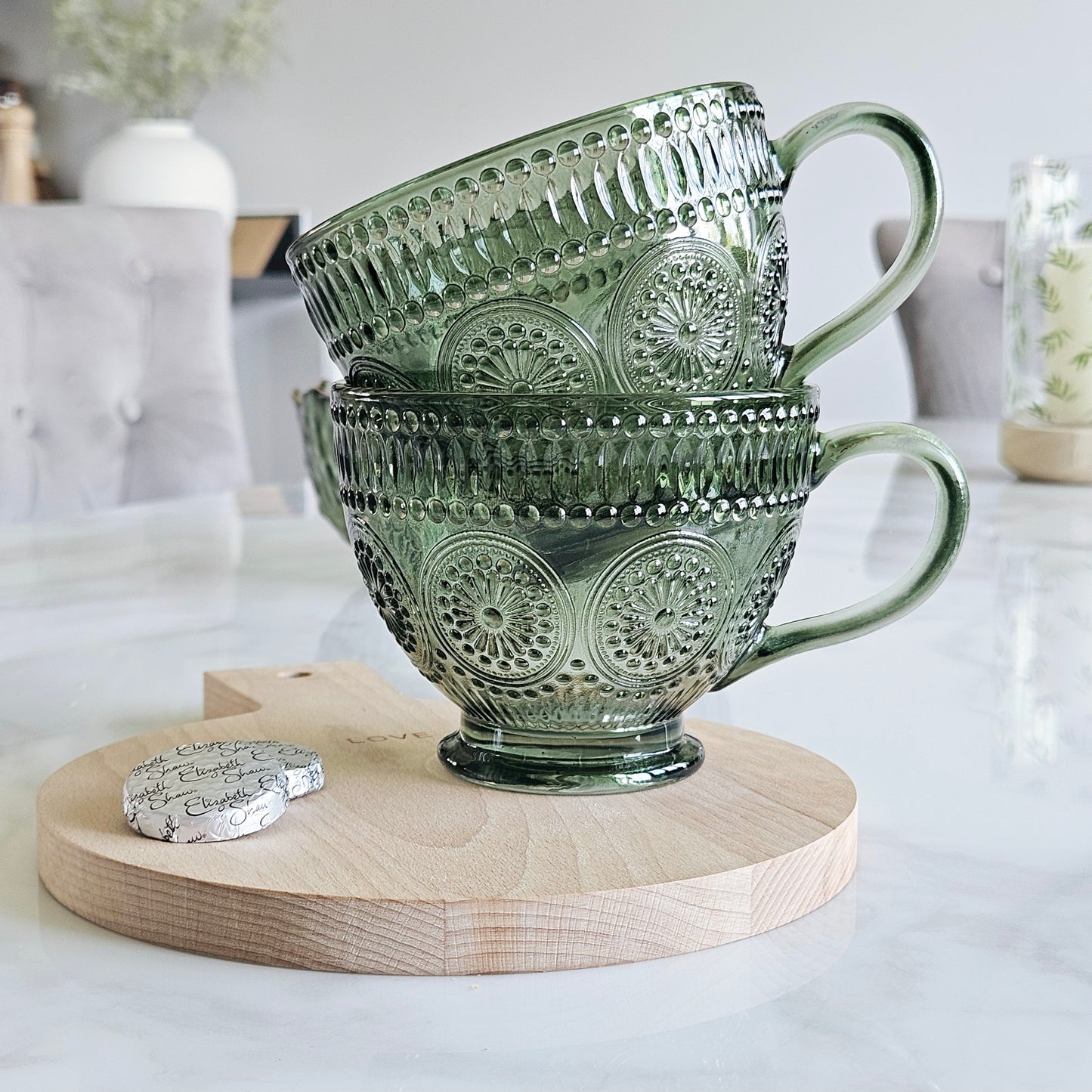 set of two glass green pressed patterned mugs