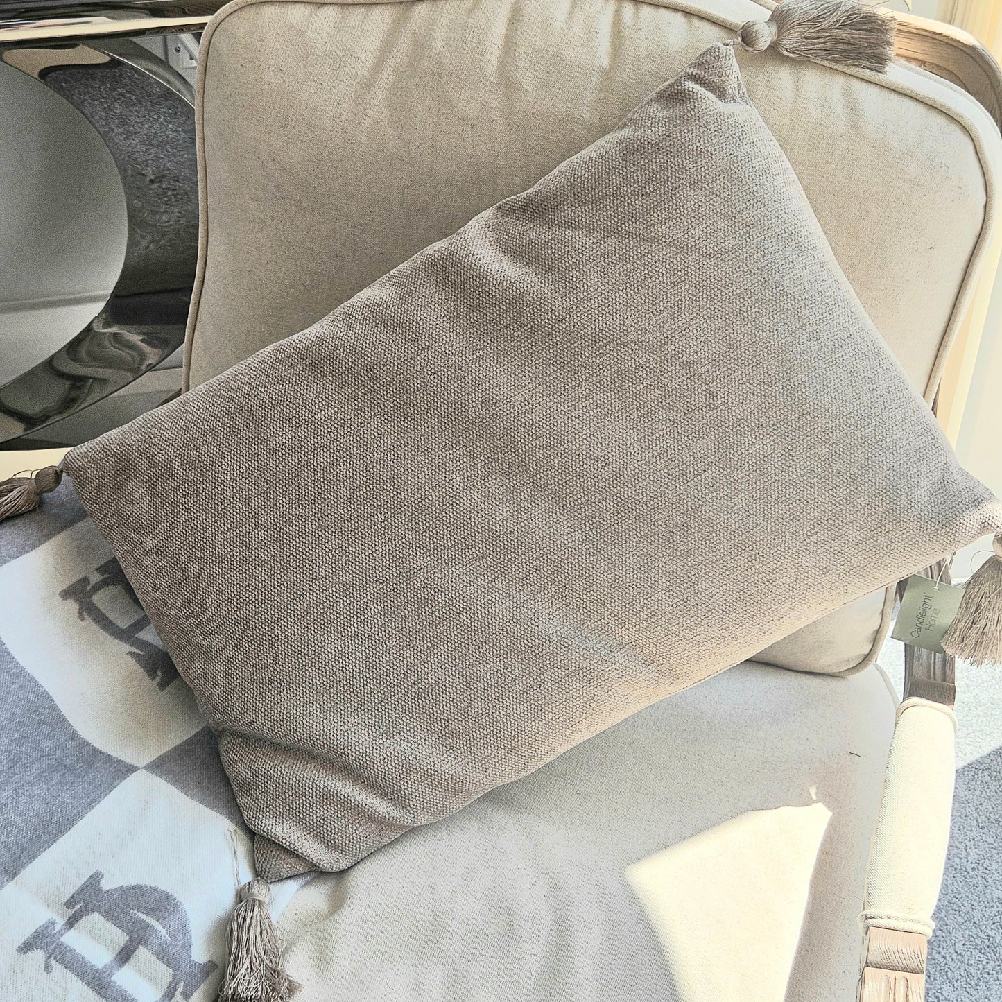 cream tussled rectangular cushion with tussles on each corner 40cm
