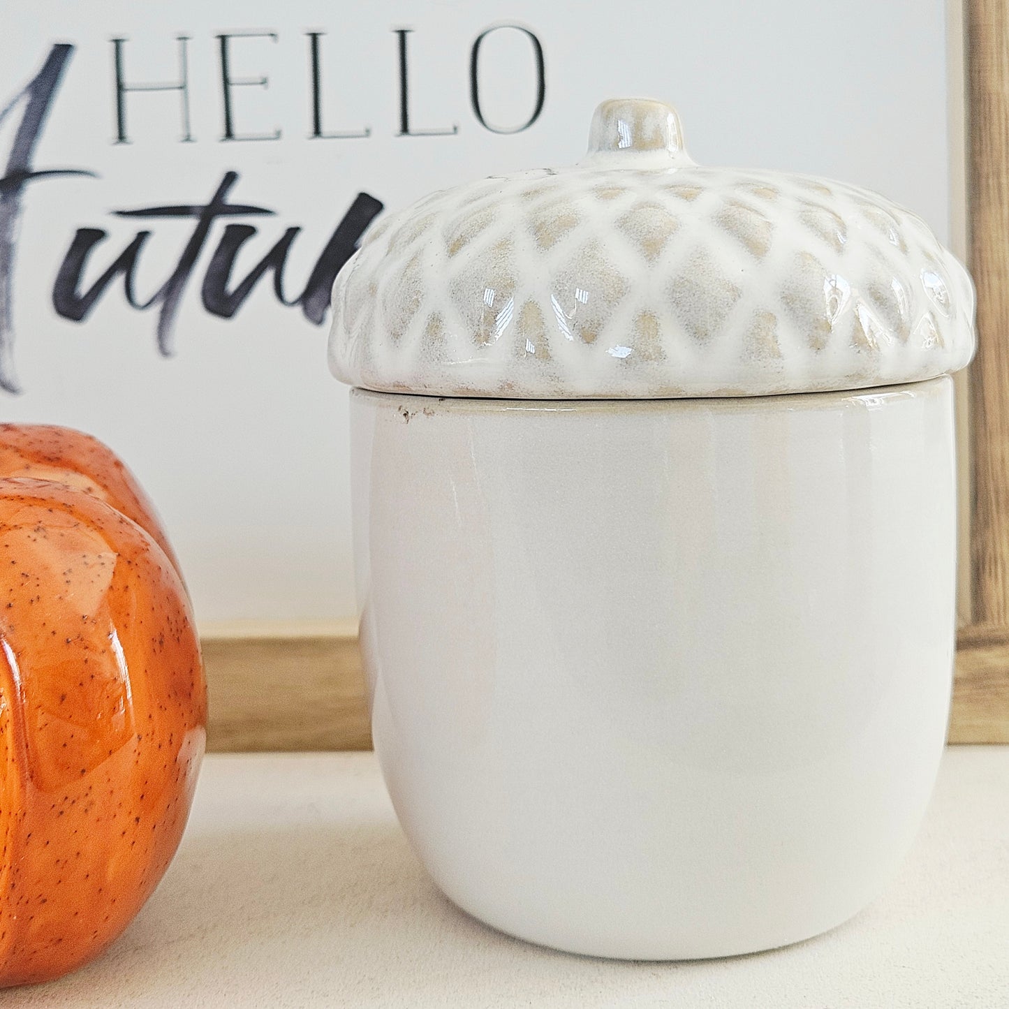 white porcelain pinecone candle with removable lid