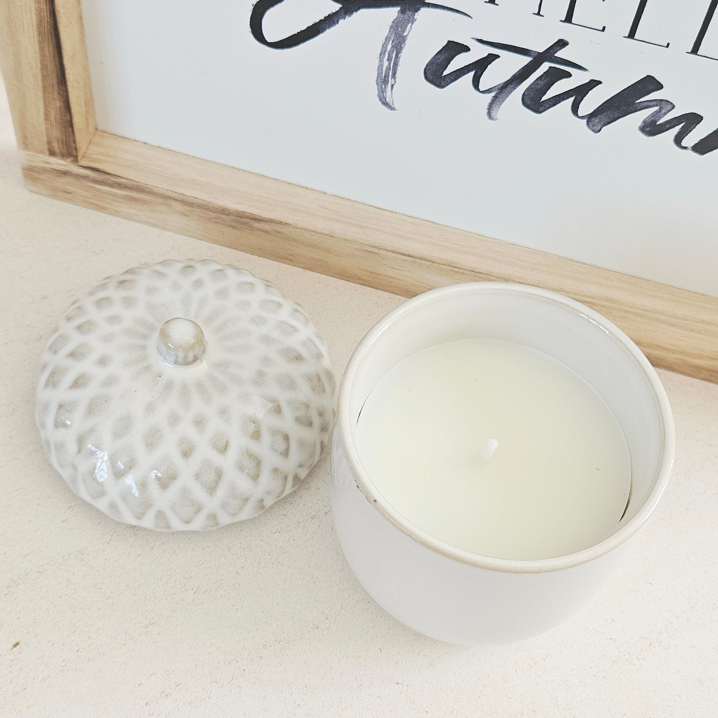 white porcelain pinecone candle with removable lid