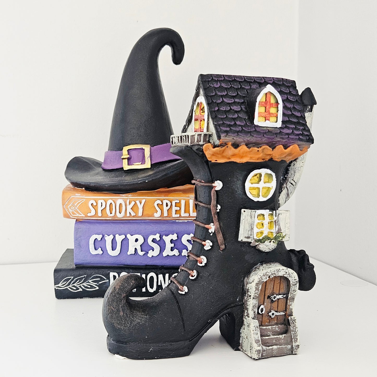 Decorative witch's boot with a house on top,