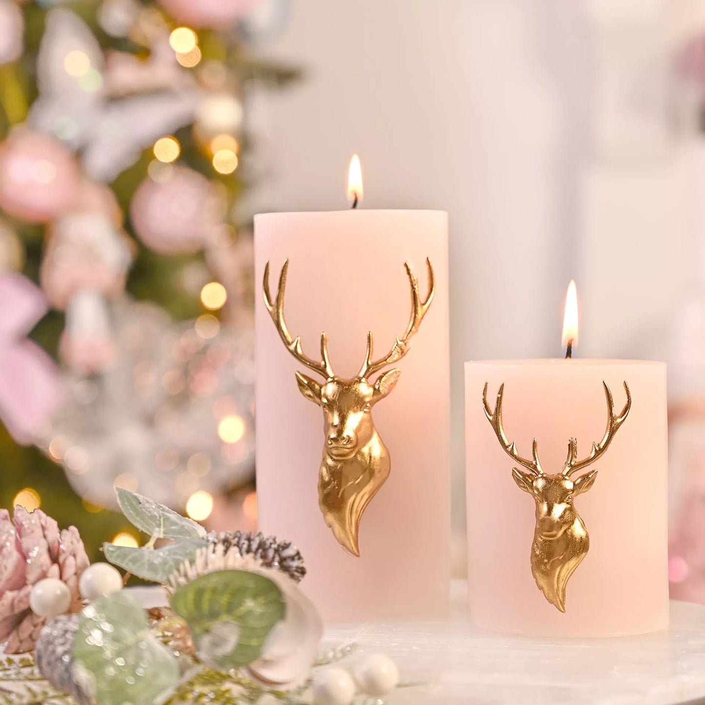 large pink blush candle with gold stag head