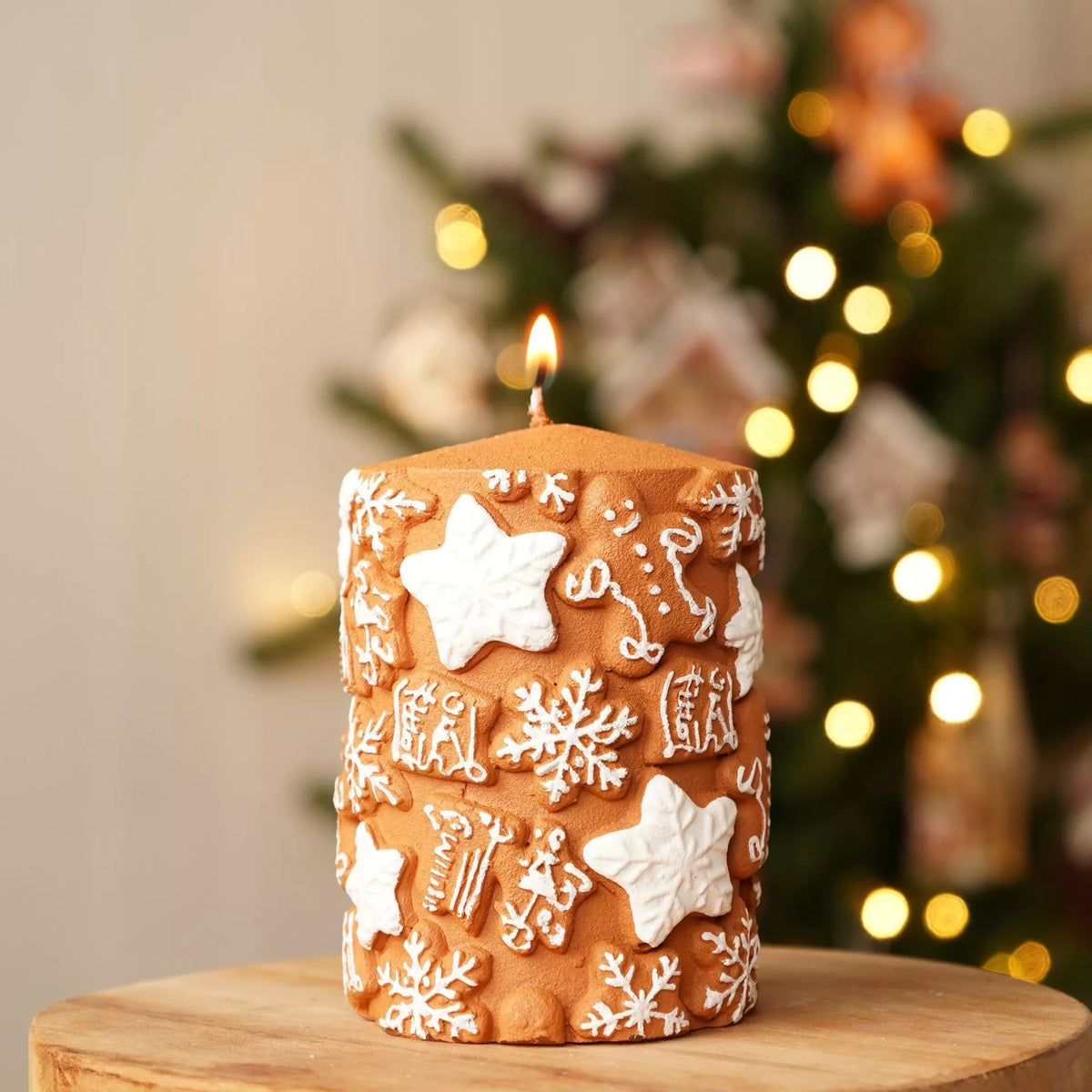 11cm gingerbread embossed Christmas pillar candle with snowflake and star design