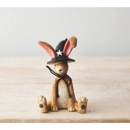 Sitting bunny rabbit witch with black hat and jute bow detail