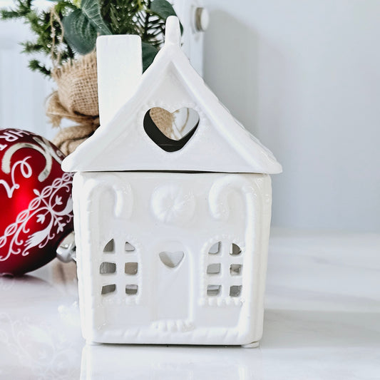 white ceramic christmas house with removable roof and t lights