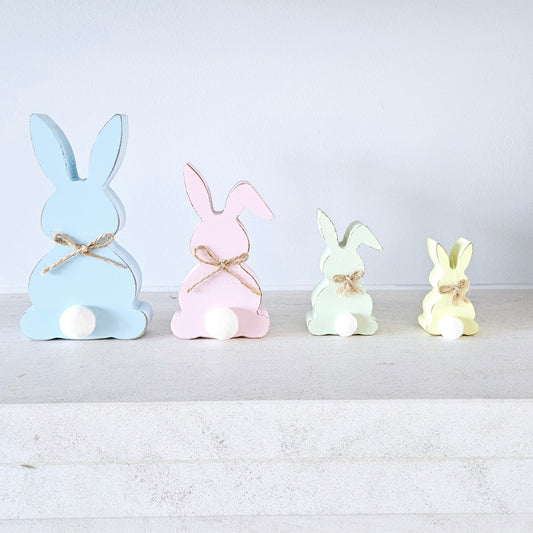 set of 4 colourful pastel bunnies with little fur bobble and jute bow string