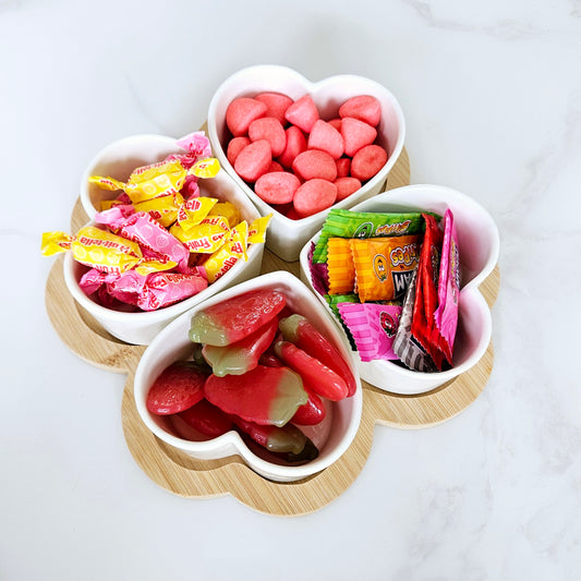 Heart shaped ceramic snacking station on a wooden base 