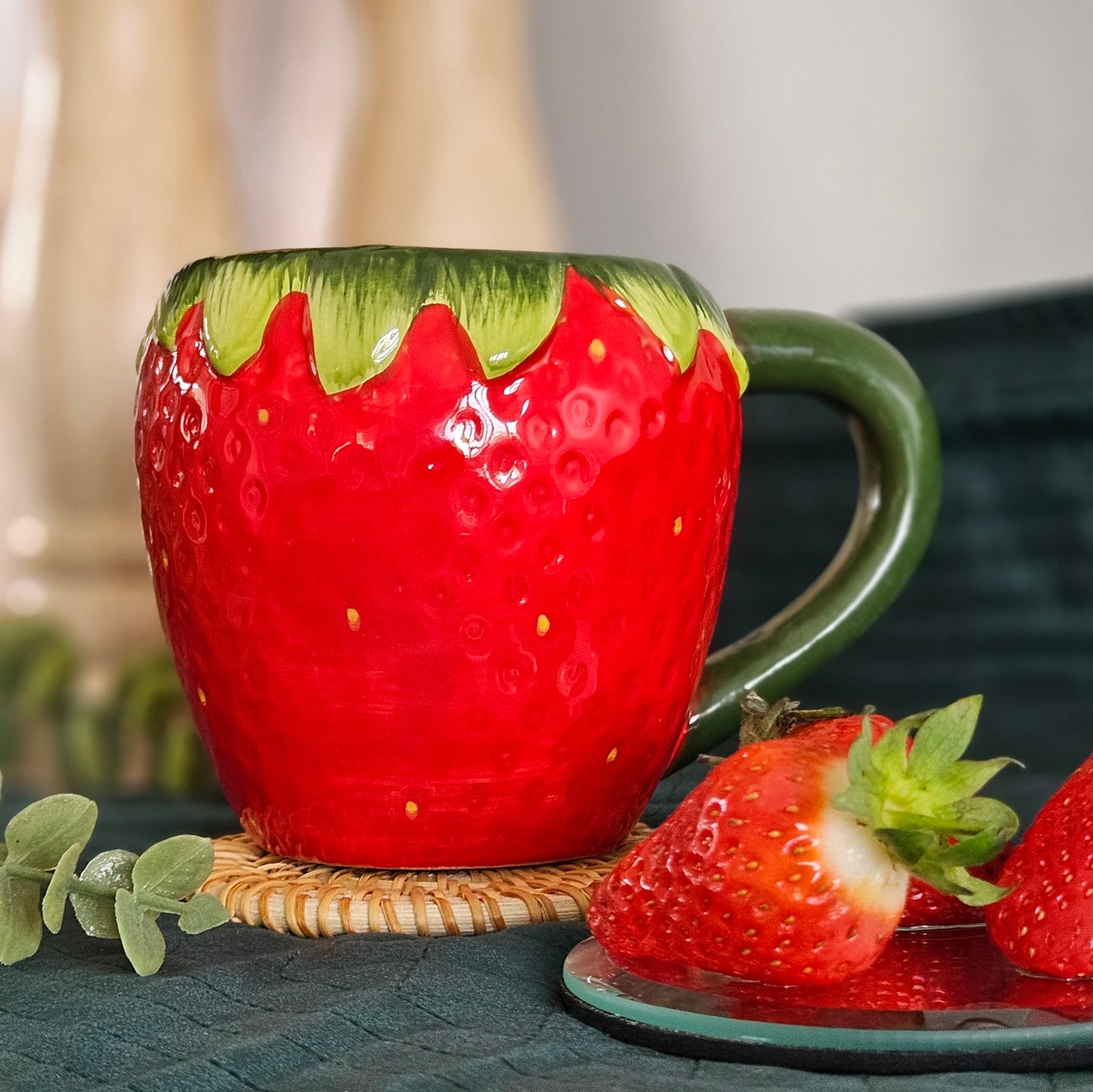 strawberry shaped mug red all over with seeds and green handle and stalk too design