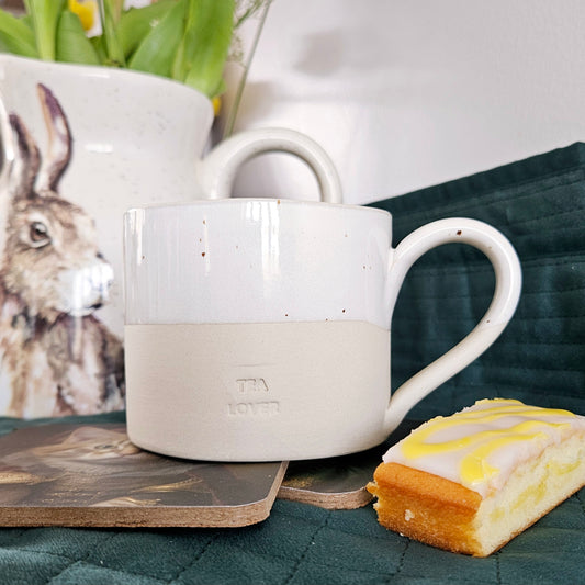 ceramic stoneware mug with tea lover engraved into it and speckled detail handmade