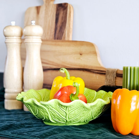 large green leafy cabbage bowl by cottage garden