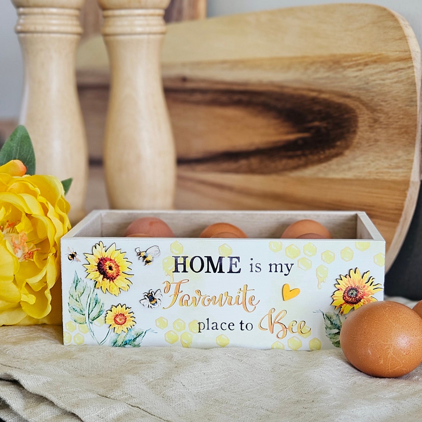 Bee Happy wooden Egg Holder for 6 eggs with bee and flora design featuring home is my favourite place to bee wording