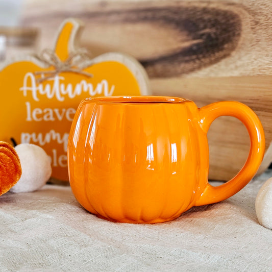 Orange pumpkin shaped mug for autumn