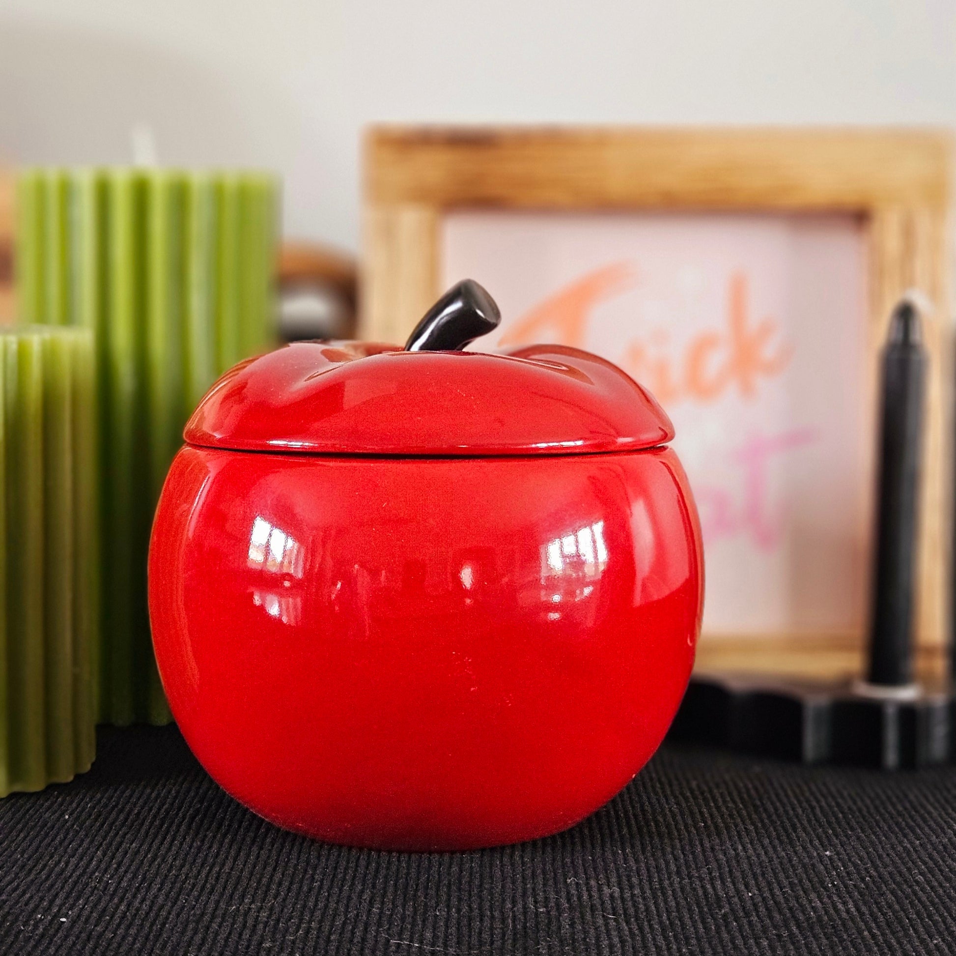 Red ceramic apple oil burner with black stalk top and removable lid