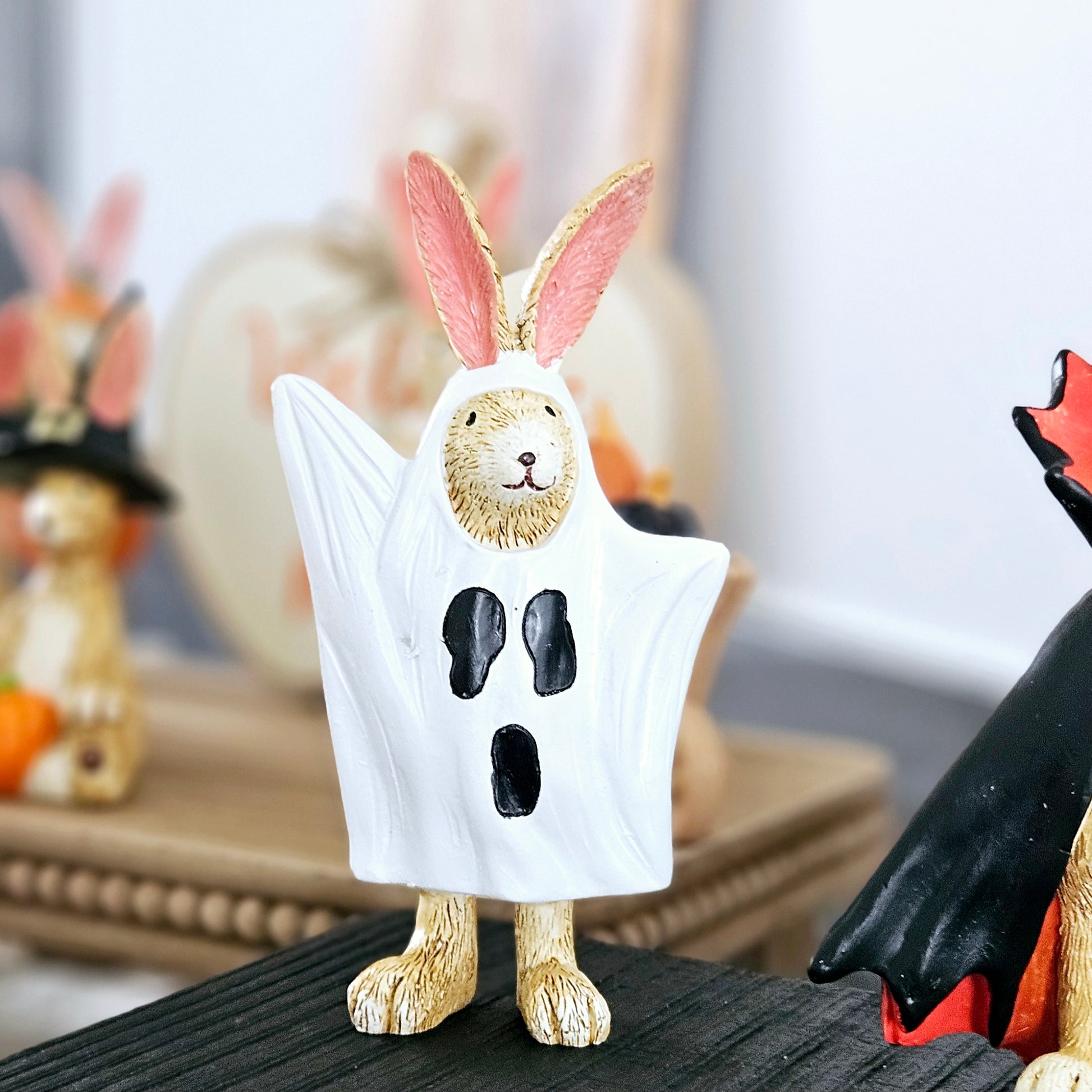 ghost rabbit ornament dressed in white ghost costume with black face