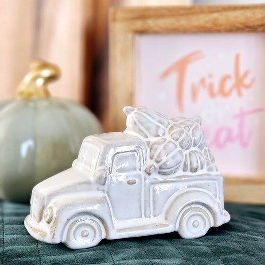 cramic pumpkin truck ornament with pumpkins on the roof