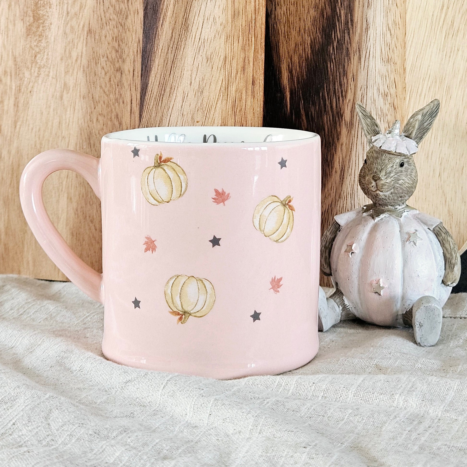 Pink hello pumpkin mug with pumpkins stars and leaves design nd hello pumpkin wording written inside