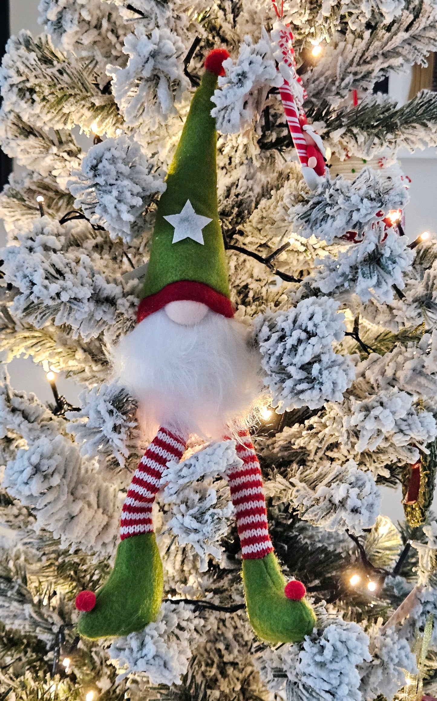 elf sitting fabric gonk with furry beard green hat with a white star