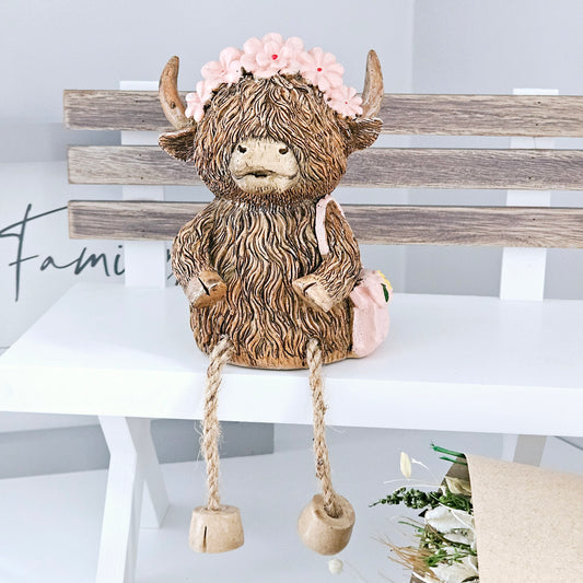 Highland cow sitting Ornament money box wearing a pink flower hairband and pink handbag