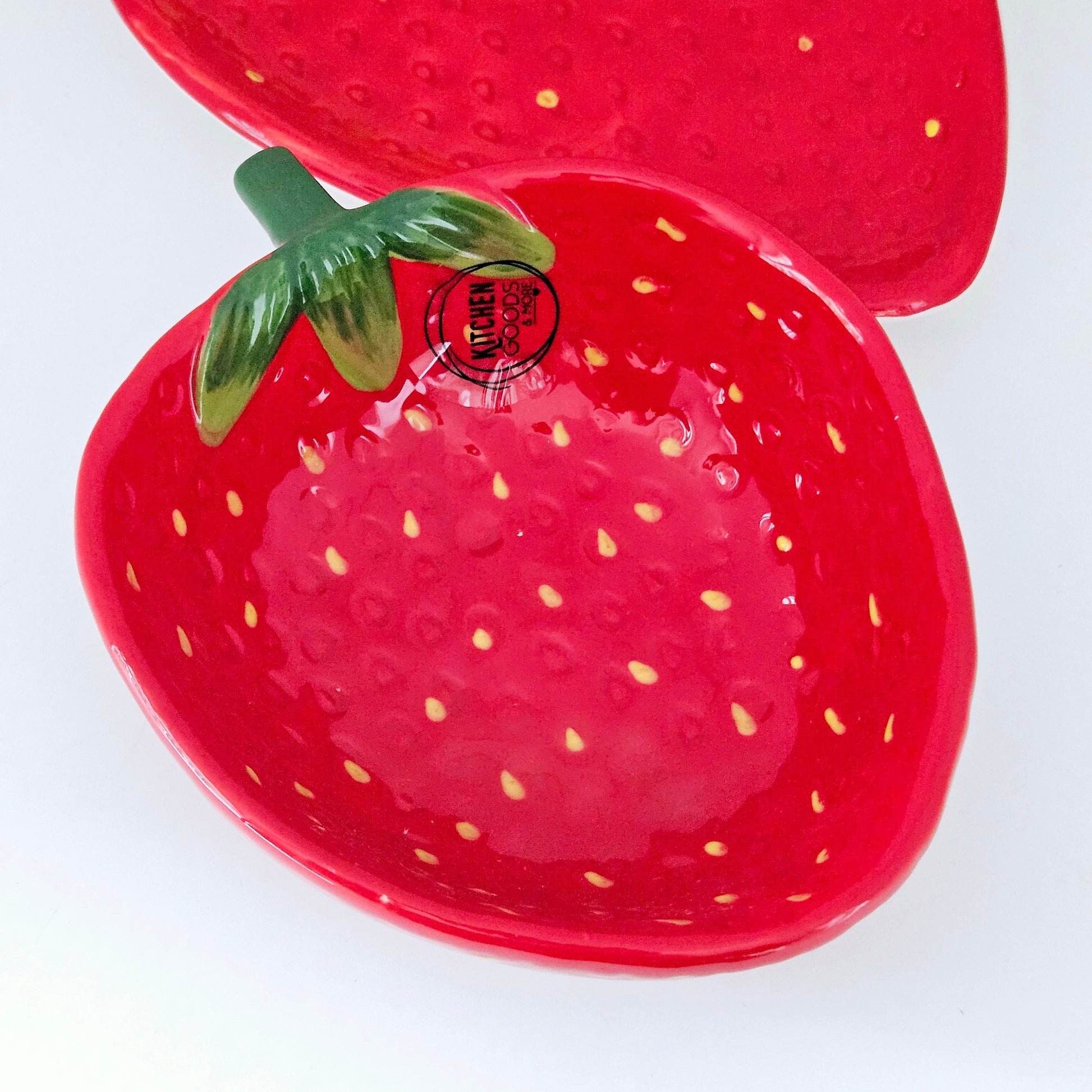 strawberry shaped bowl with pips detail and green stem by kitchen goods