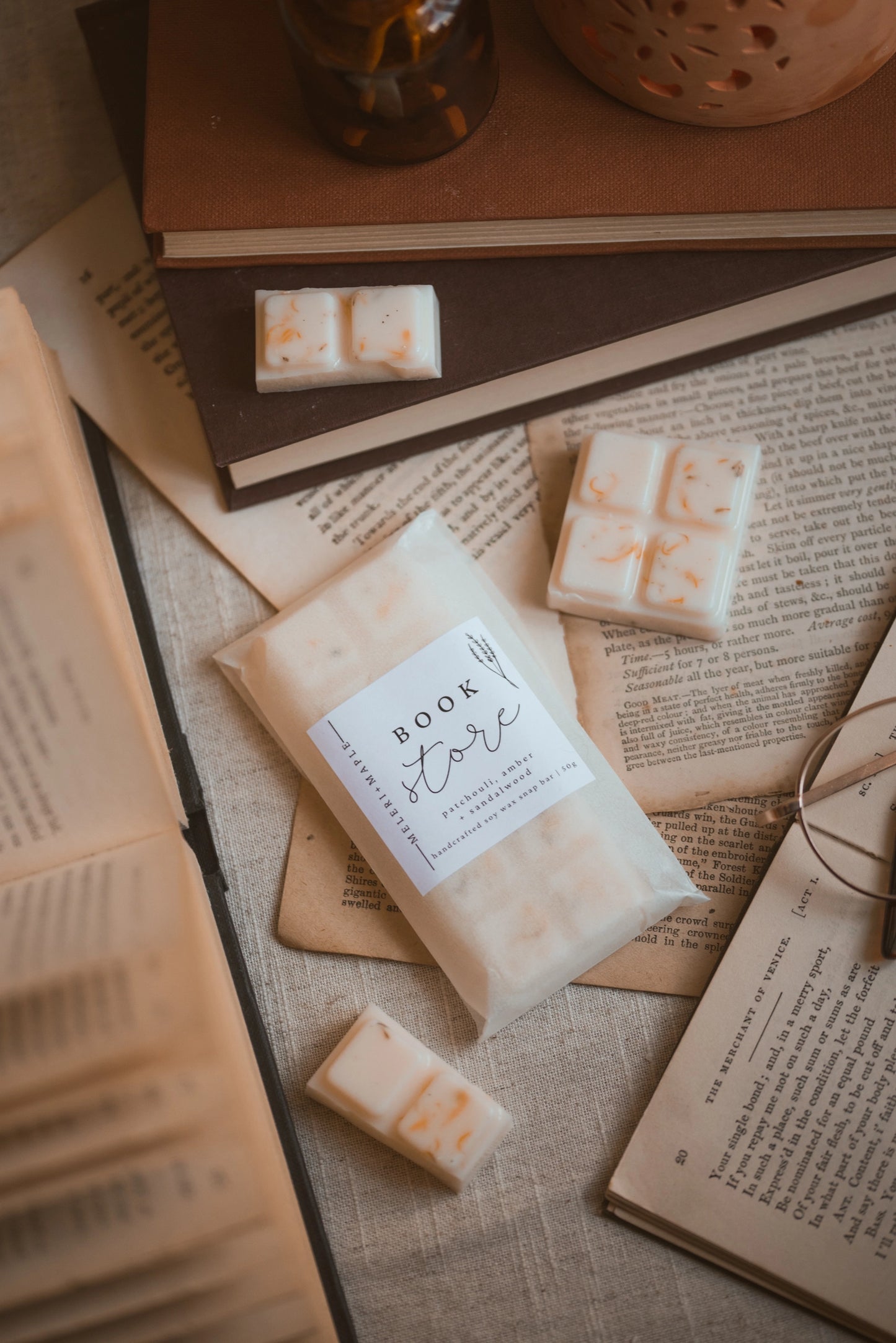 wax melts meleri and maple snap Bar of  'Book Store' label on an open book